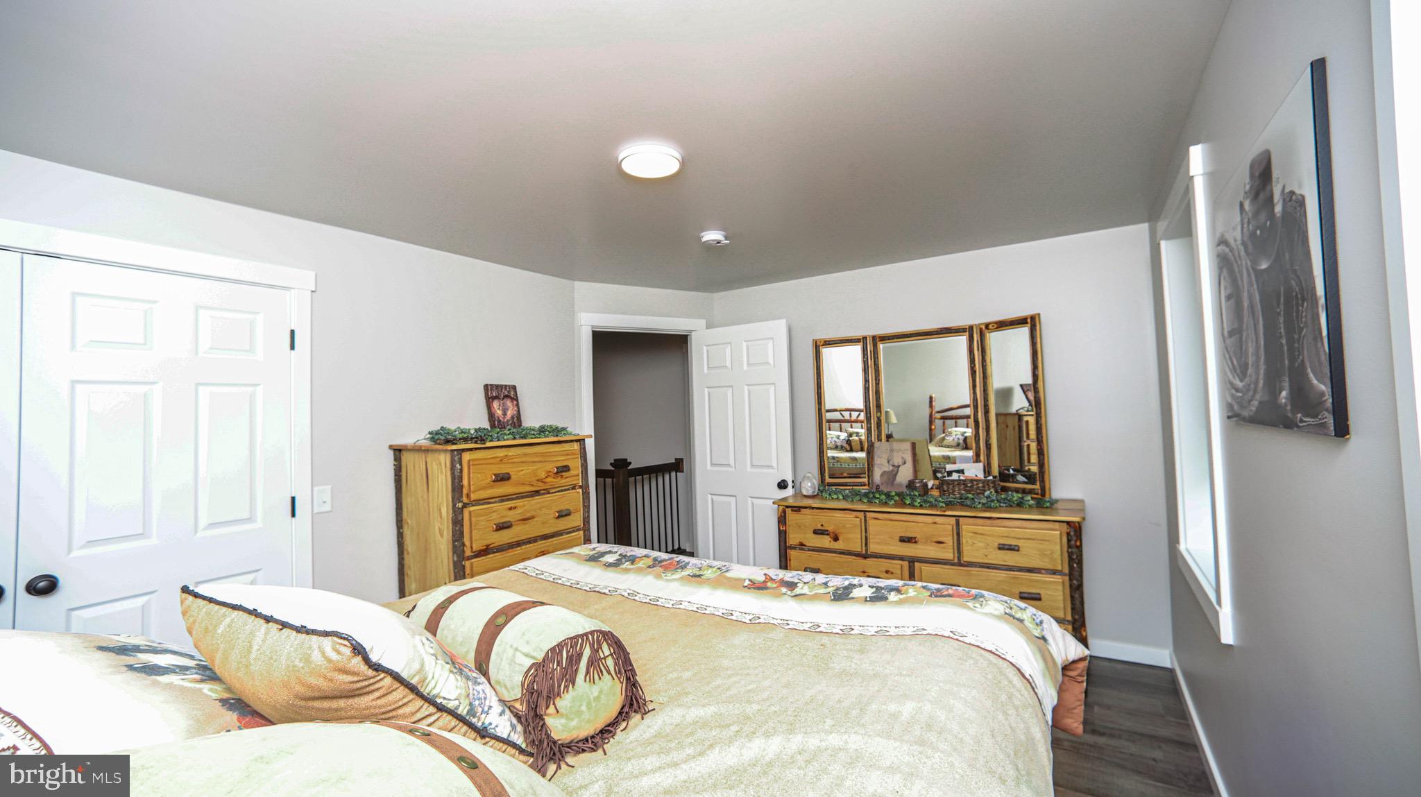 1203 Roxbury Road Newburg, PA 17240 - Photo 20 of 64 a bedroom with a bed and wooden floor
