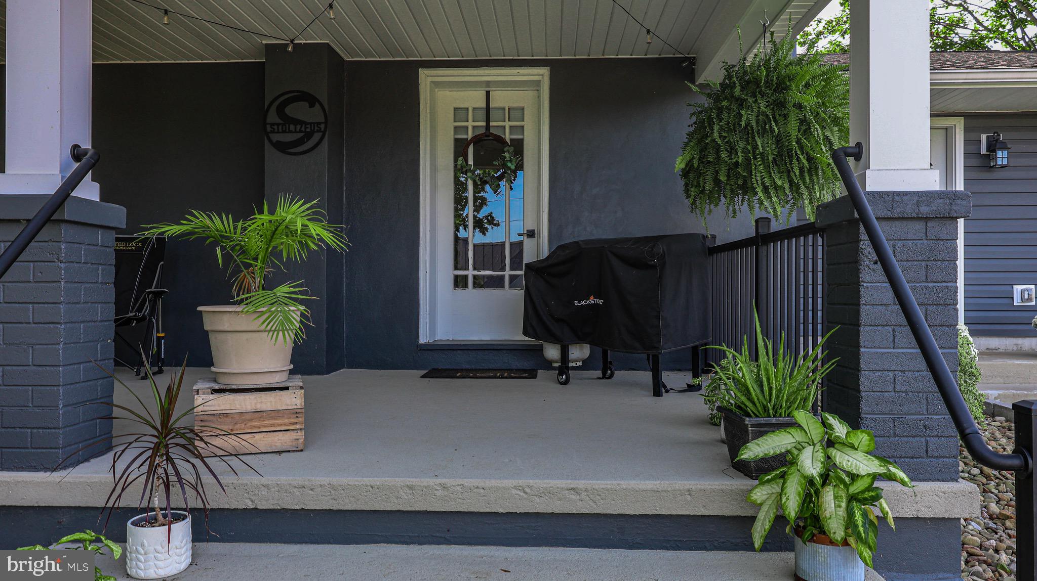 1203 Roxbury Road Newburg, PA 17240 - Photo 28 of 64 a potted plant sitting on the side of a building