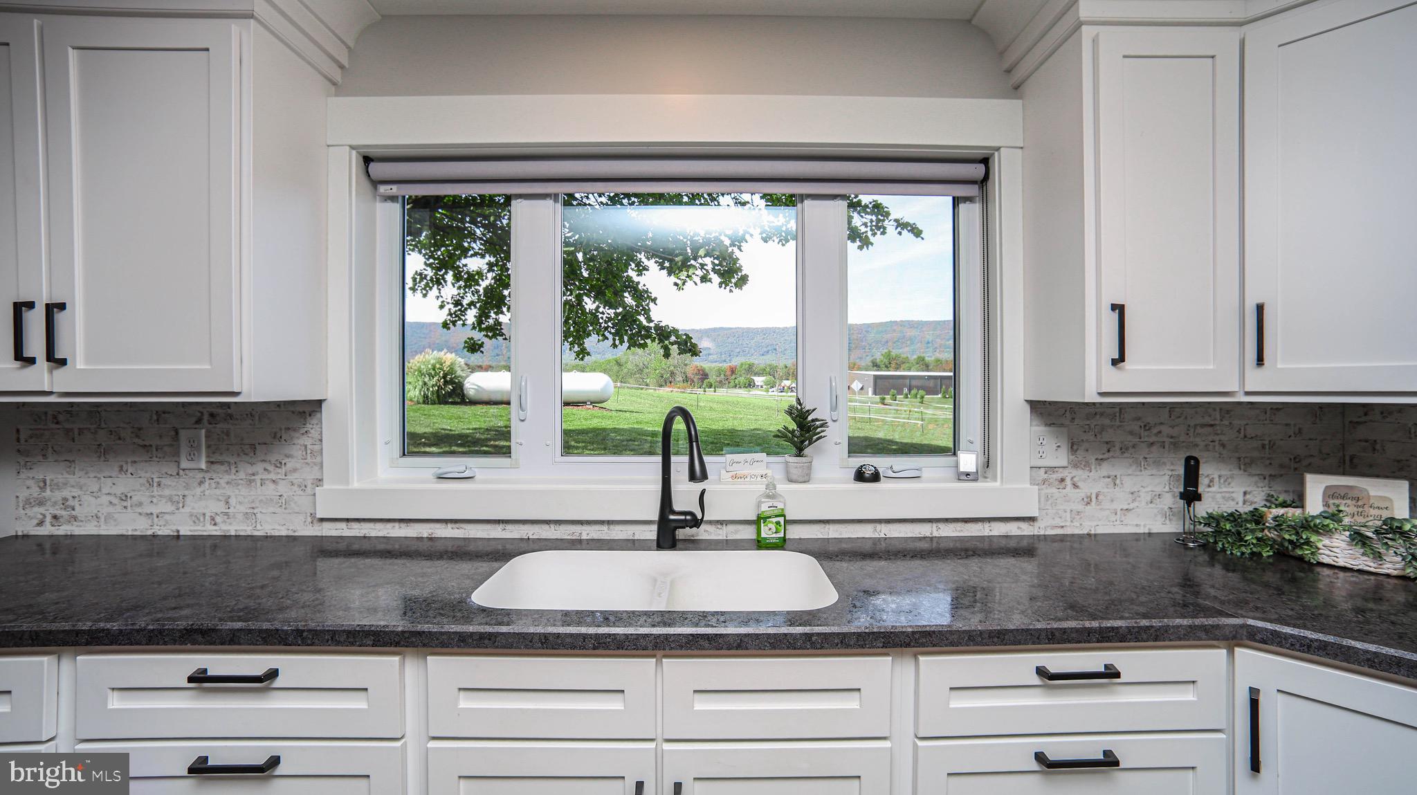 1203 Roxbury Road Newburg, PA 17240 - Photo 3 of 64 a kitchen with granite countertop a window and white cabinets