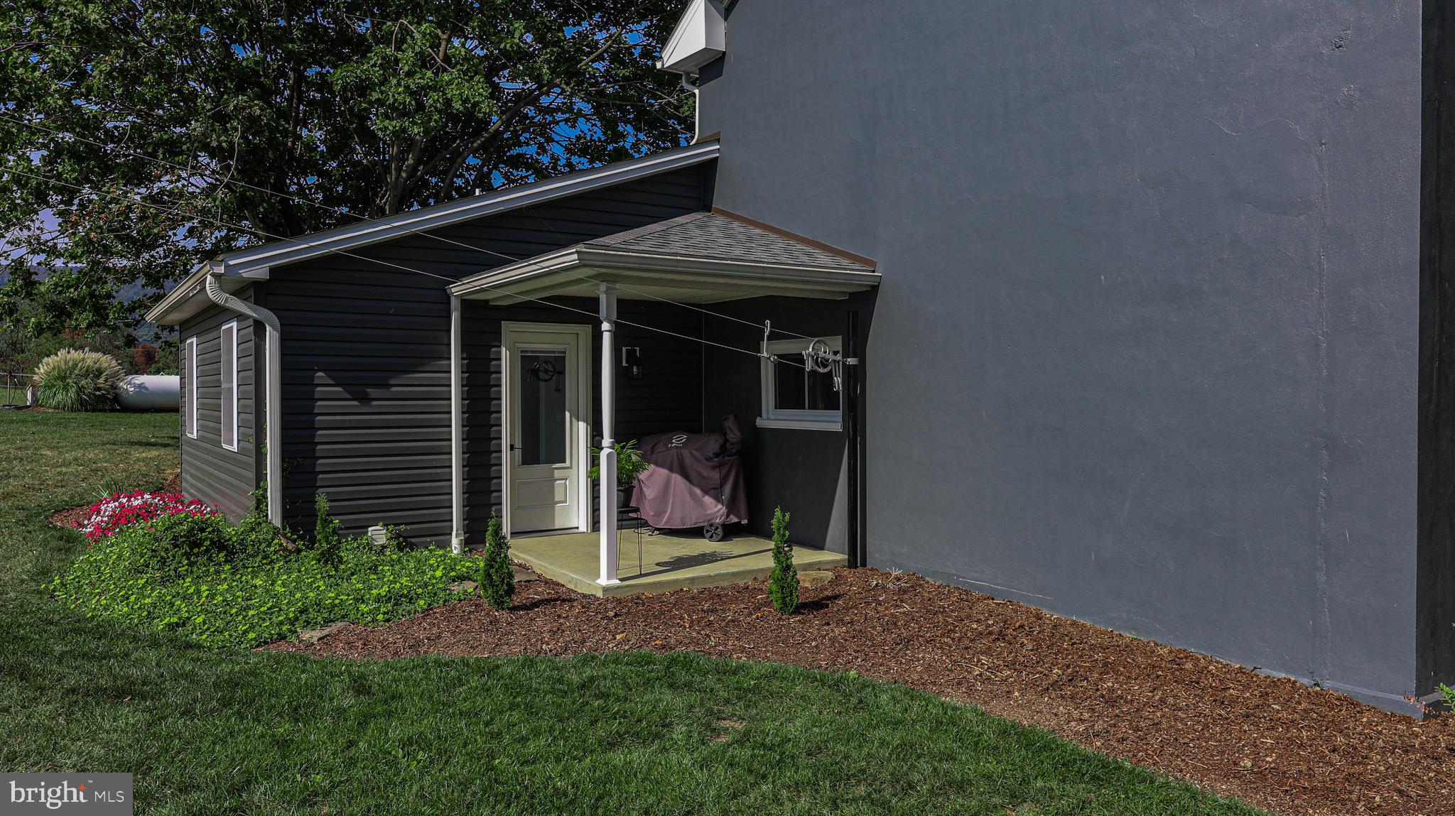 1203 Roxbury Road Newburg, PA 17240 - Photo 31 of 64 a view of a backyard with a table and chair