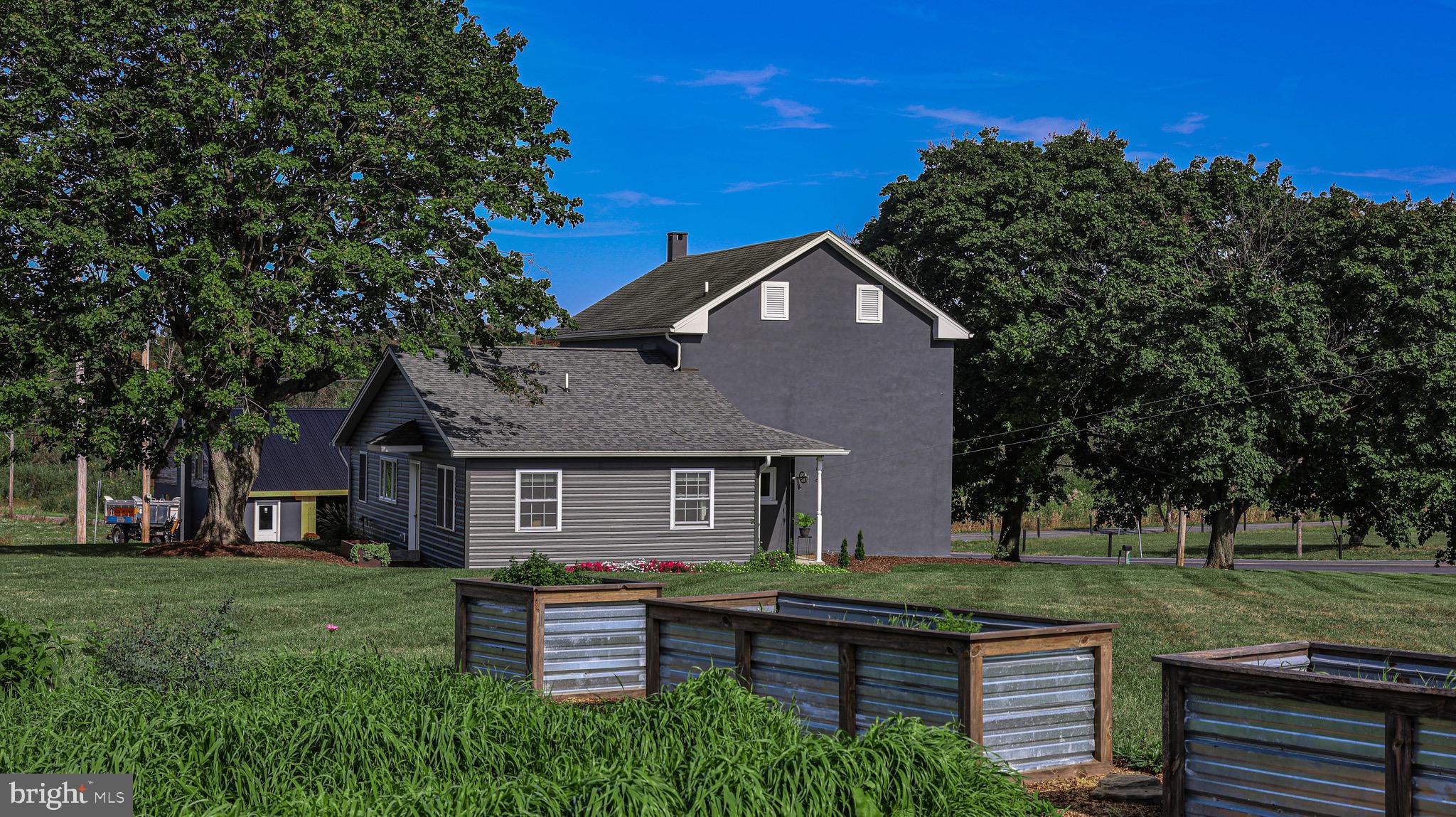 1203 Roxbury Road Newburg, PA 17240 - Photo 34 of 64 a front view of a house with a garden