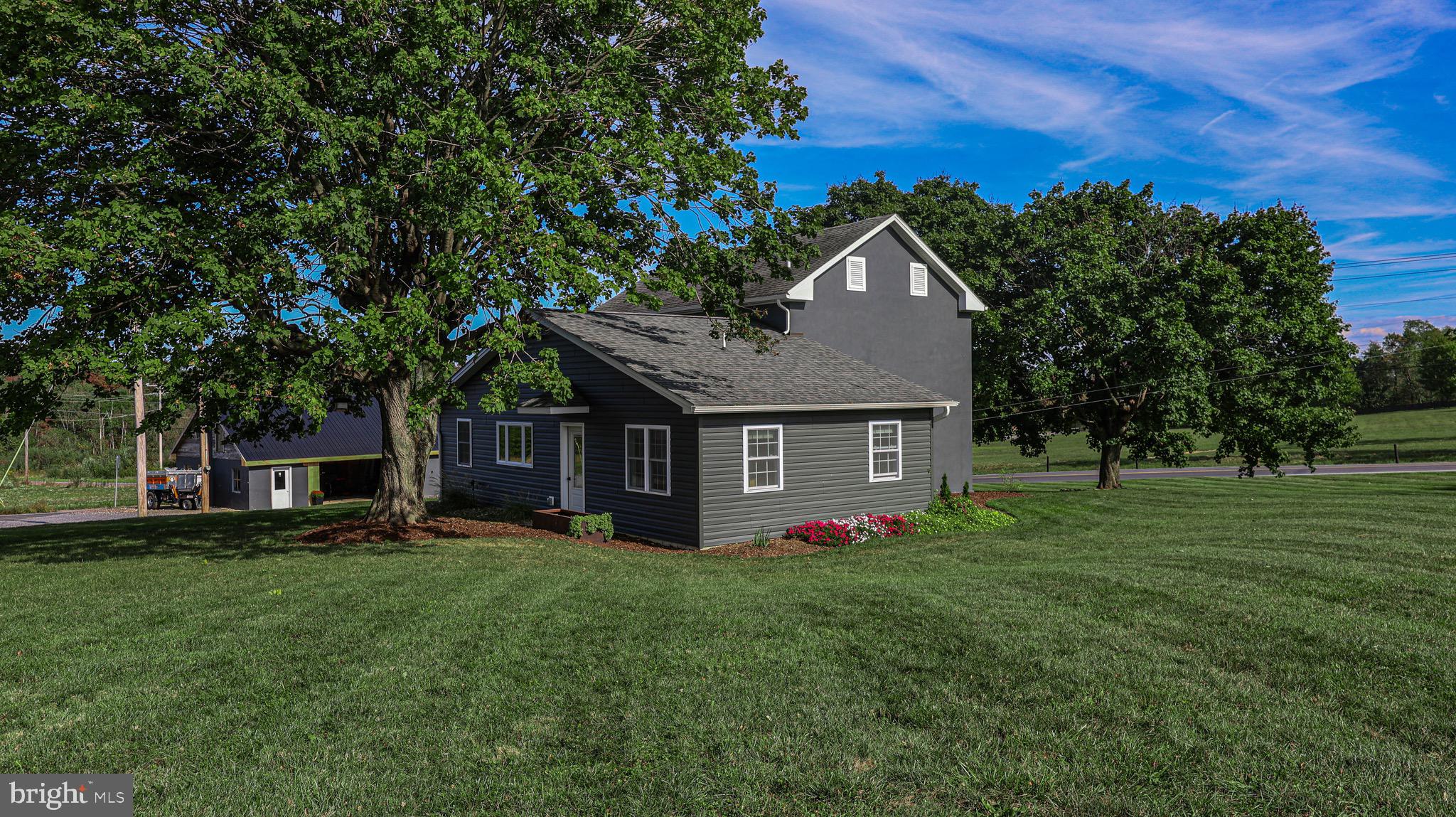 1203 Roxbury Road Newburg, PA 17240 - Photo 36 of 64 a front view of house with yard and trees in the background