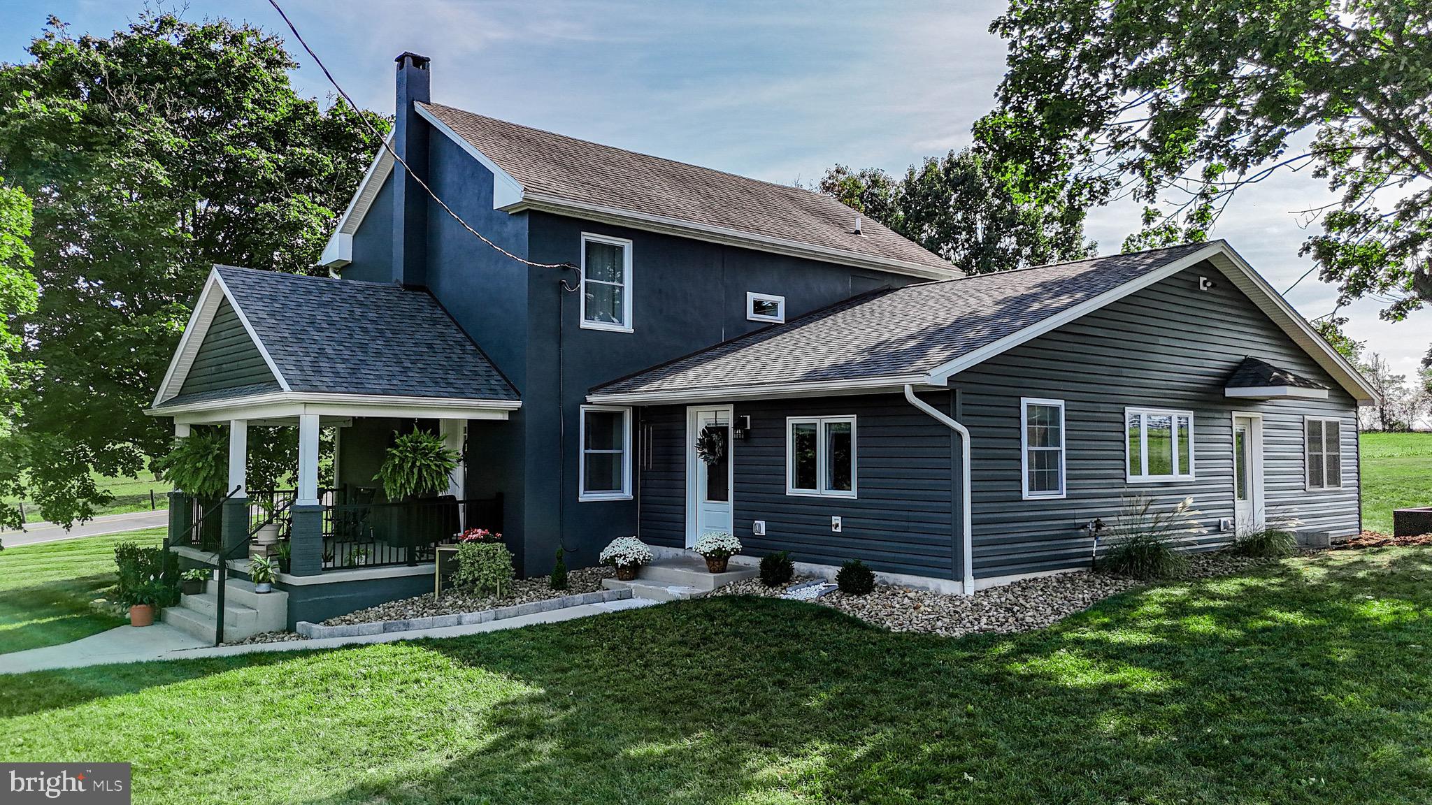 1203 Roxbury Road Newburg, PA 17240 - Photo 46 of 64 a front view of house with a garden and patio