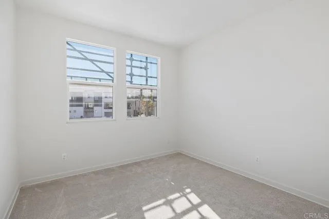 an empty room with windows