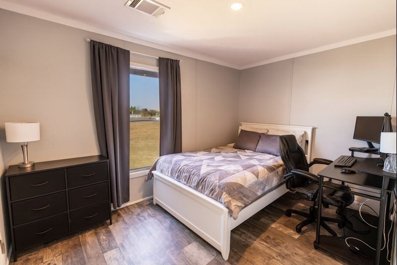 2752 Remmert Road Bellville, TX 77418 - Photo 13 of 19 A cozy third bedroom, ideal for creating a comfortable and functional personal space.