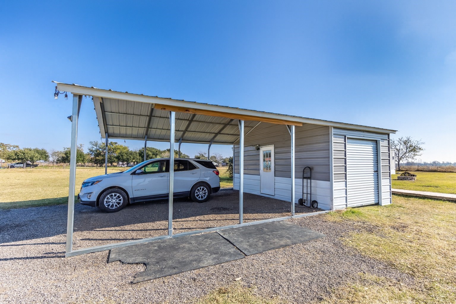 2752 Remmert Road Bellville, TX 77418 - Photo 5 of 19 This large, two car carport with attached storage area will be great for parking your vehicles or farm equipment.