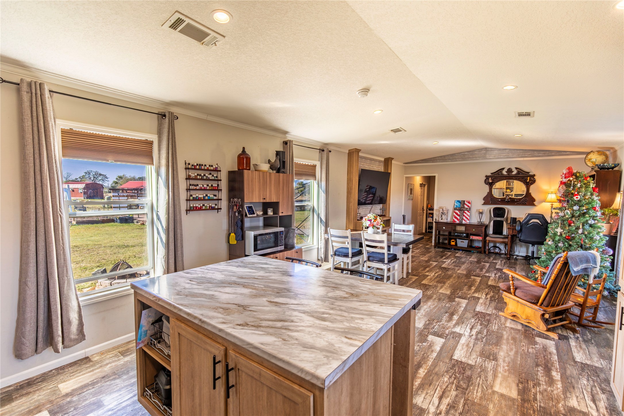 2752 Remmert Road Bellville, TX 77418 - Photo 8 of 19 This spacious, open-concept home features natural light from large windows, and a cozy dining space.