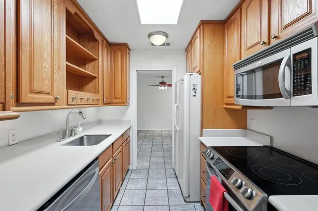 a kitchen with a sink and a window