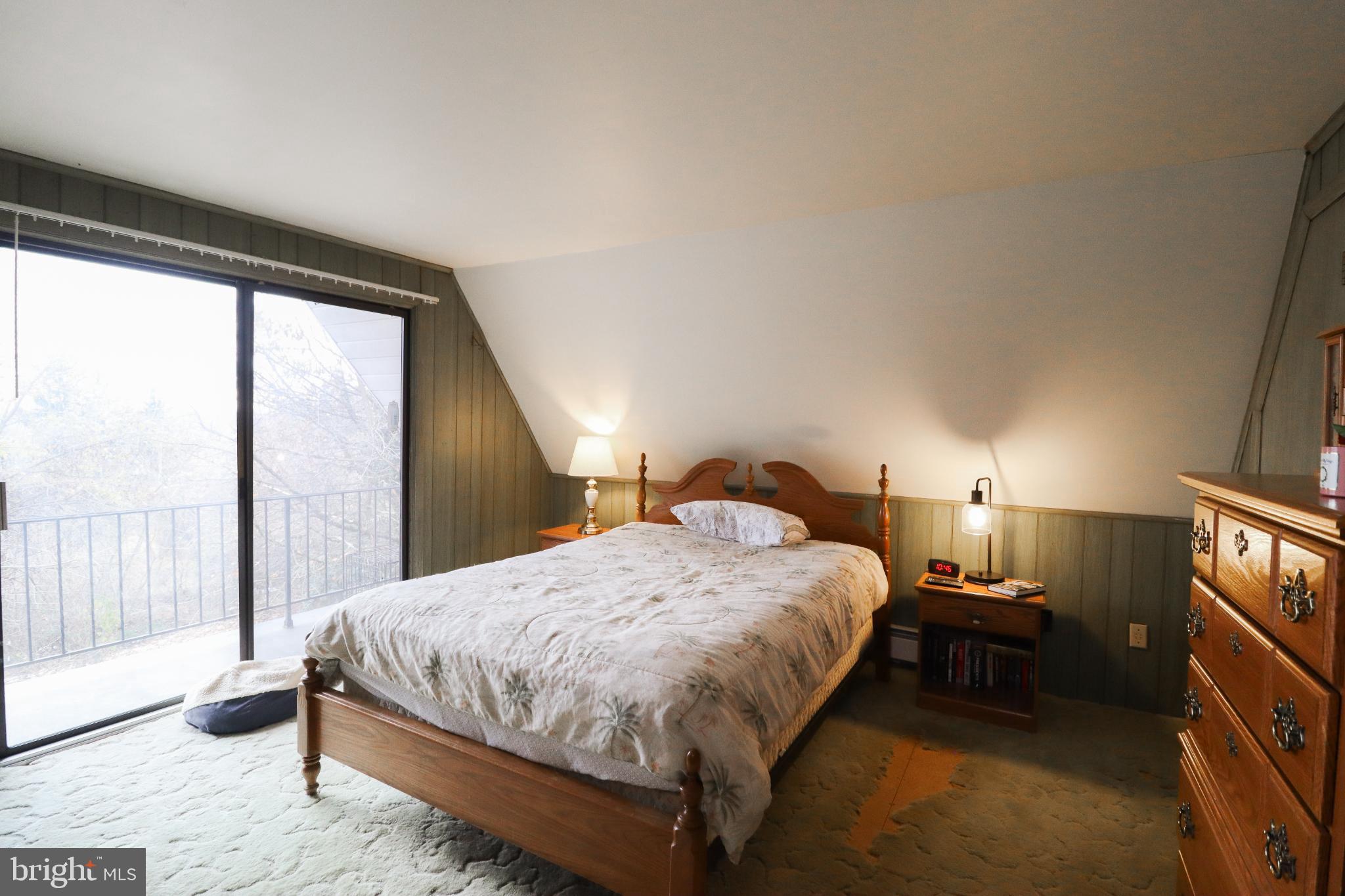 81 Rupp Road Gettysburg, PA 17325 - Photo 27 of 53 a bedroom with a bed lamp and window