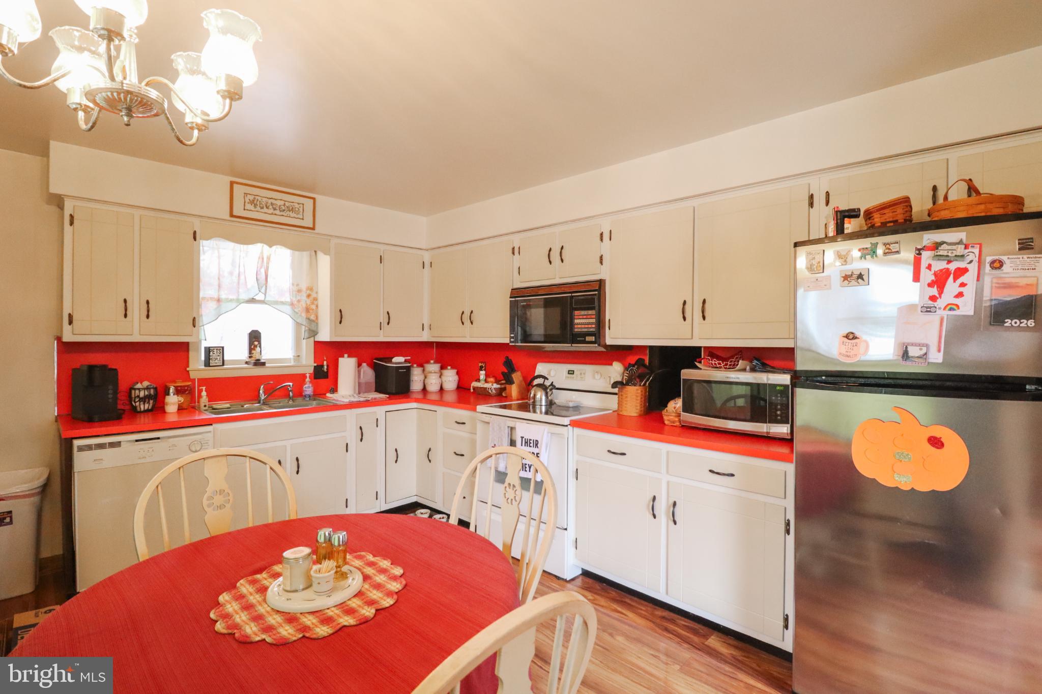 81 Rupp Road Gettysburg, PA 17325 - Photo 10 of 53 a room with stainless steel appliances kitchen island granite countertop a sink dishwasher and a stove with wooden floor