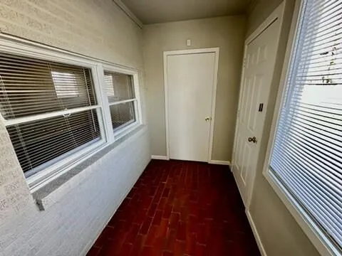 a view of backyard with wooden fence