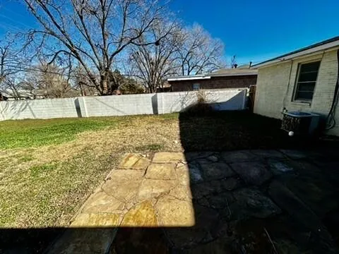 a view of a backyard of the house