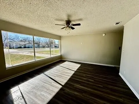 a kitchen with stainless steel appliances granite countertop a refrigerator a stove top oven and a sink with granite countertops