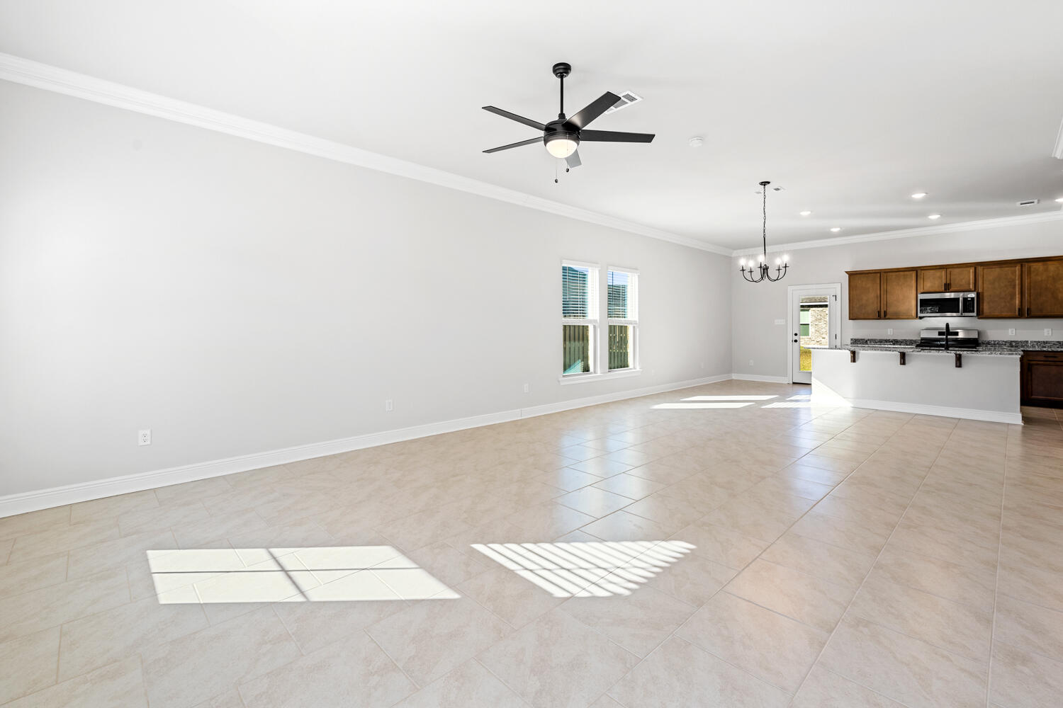 130 Hydrangea Boulevard Freeport, FL 32439 - Photo 7 of 21 a view of a livingroom with a ceiling fan and window