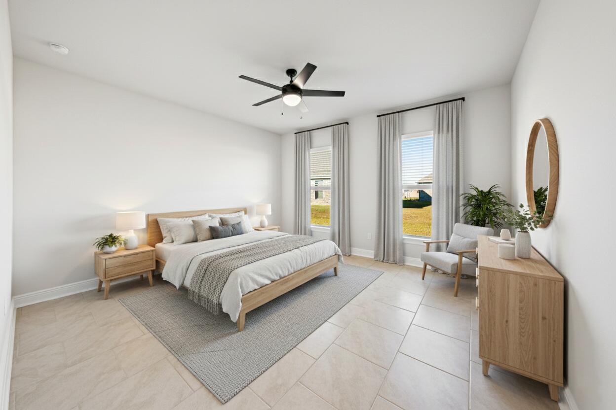 130 Hydrangea Boulevard Freeport, FL 32439 - Photo 9 of 21 a spacious bedroom with a bed and a chandelier