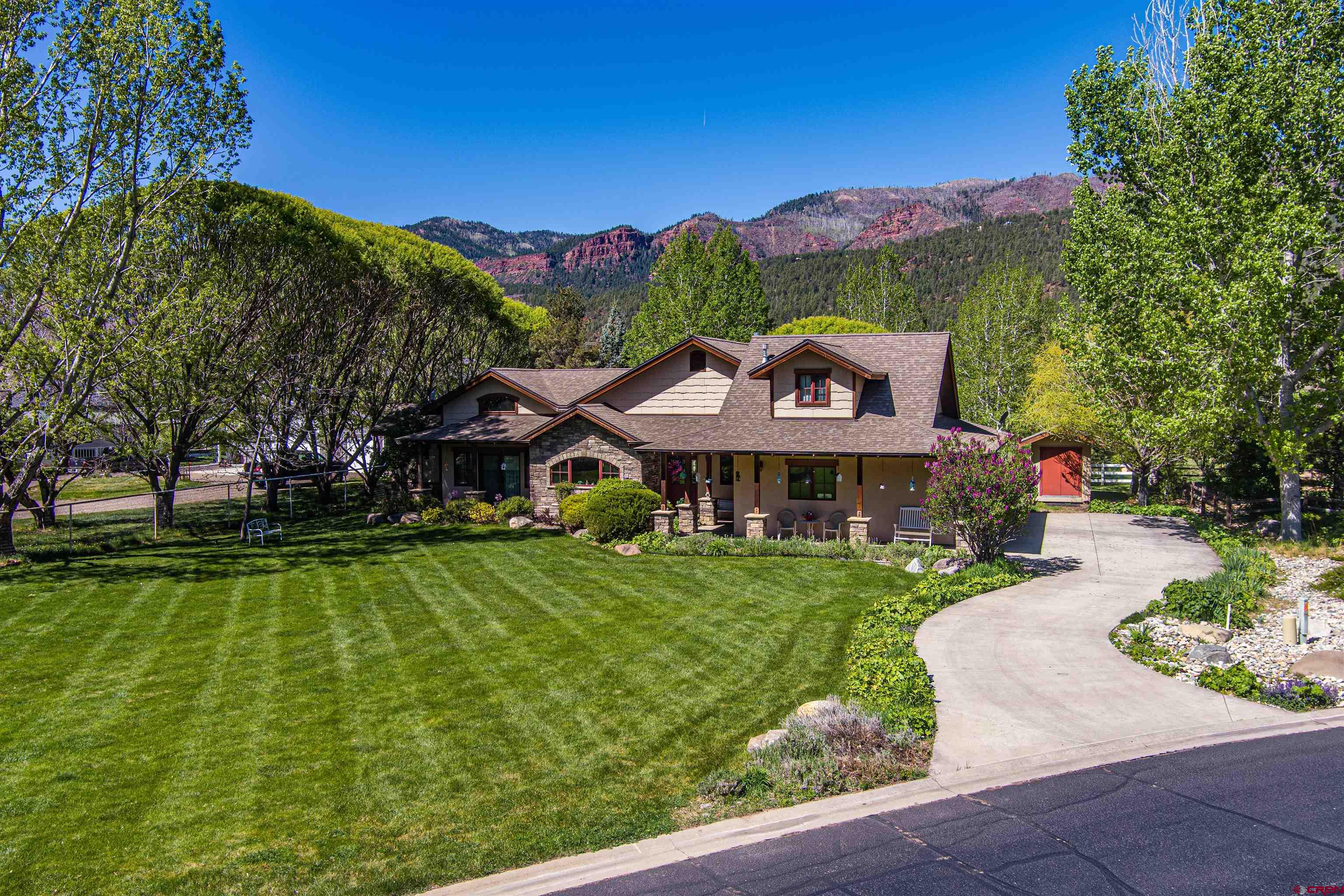 a view of a house with a big yard