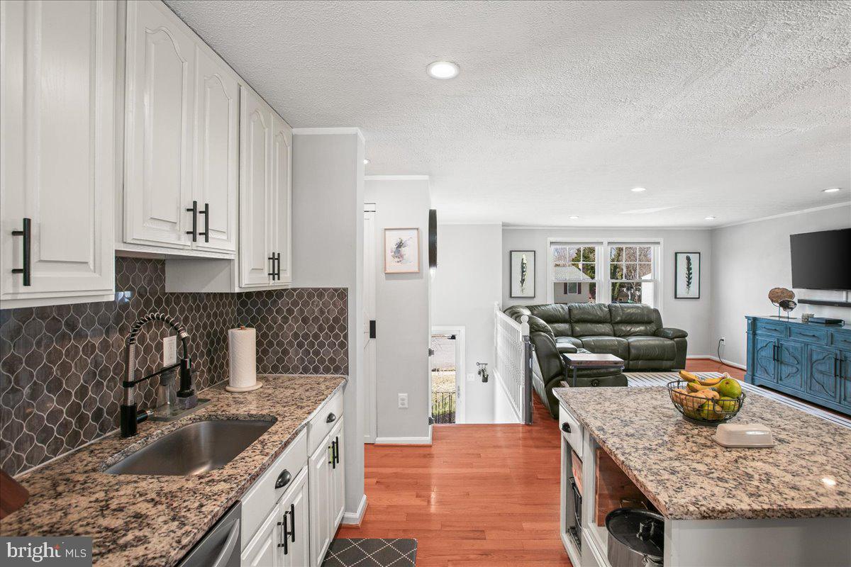 5829 Parakeet Drive Burke, VA 22015 - Photo 12 of 27 a kitchen with granite countertop lots of counter top space