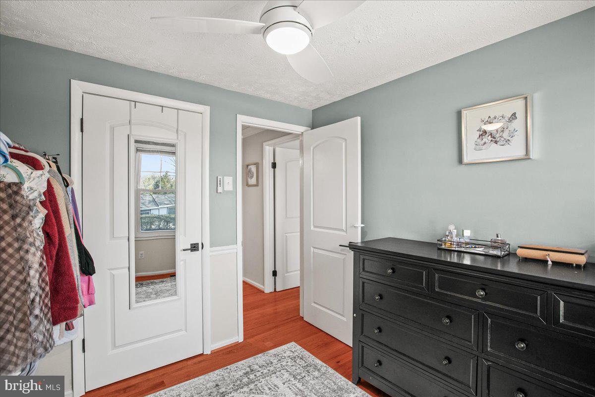 5829 Parakeet Drive Burke, VA 22015 - Photo 14 of 27 a room with a dresser and a mirror