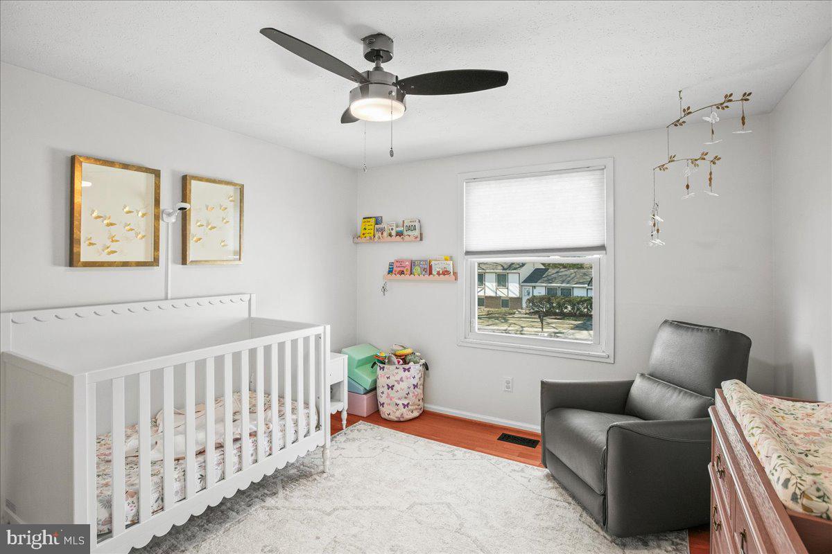 5829 Parakeet Drive Burke, VA 22015 - Photo 16 of 27 a bedroom with furniture and a window