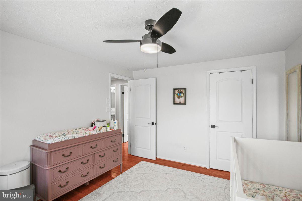 5829 Parakeet Drive Burke, VA 22015 - Photo 17 of 27 a living room with furniture and a ceiling fan