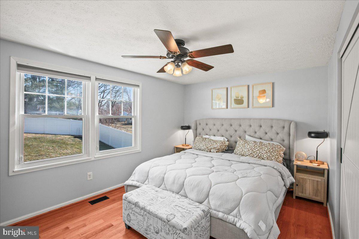 5829 Parakeet Drive Burke, VA 22015 - Photo 18 of 27 a bedroom with a bed and a window