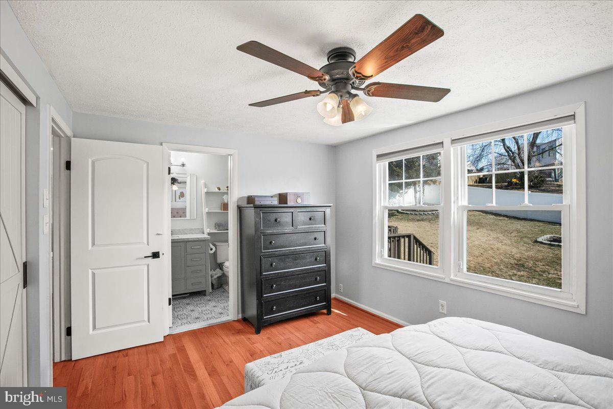 5829 Parakeet Drive Burke, VA 22015 - Photo 19 of 27 a bedroom with a bed and a window