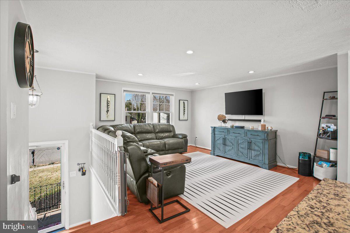 5829 Parakeet Drive Burke, VA 22015 - Photo 3 of 27 a bedroom with furniture and a flat screen tv