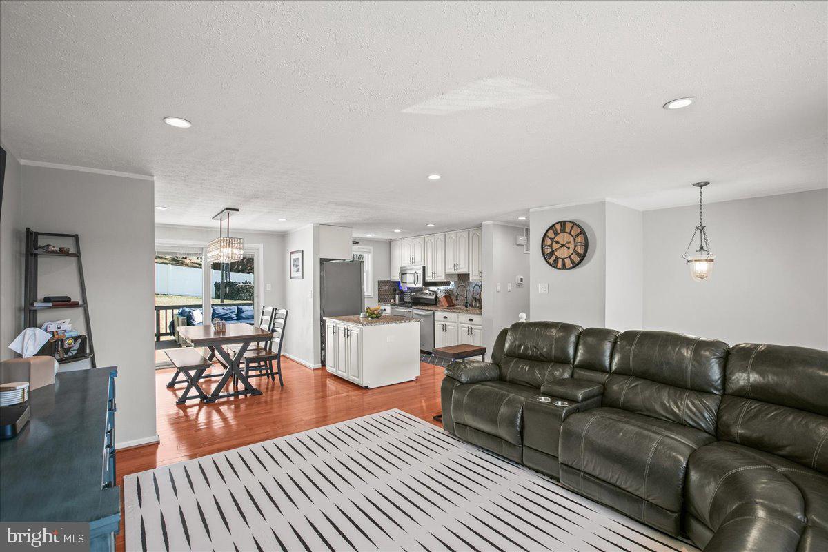 5829 Parakeet Drive Burke, VA 22015 - Photo 5 of 27 a living room with furniture and wooden floor