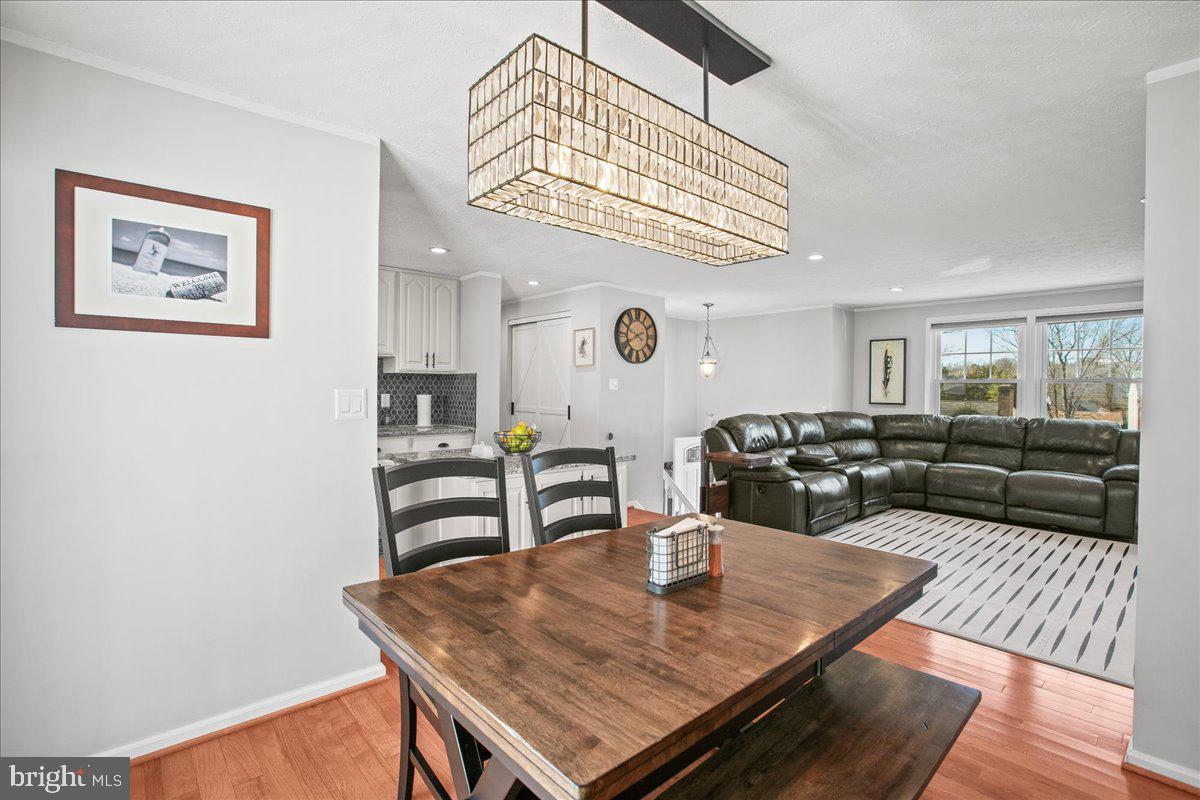 5829 Parakeet Drive Burke, VA 22015 - Photo 8 of 27 a living room with dining table