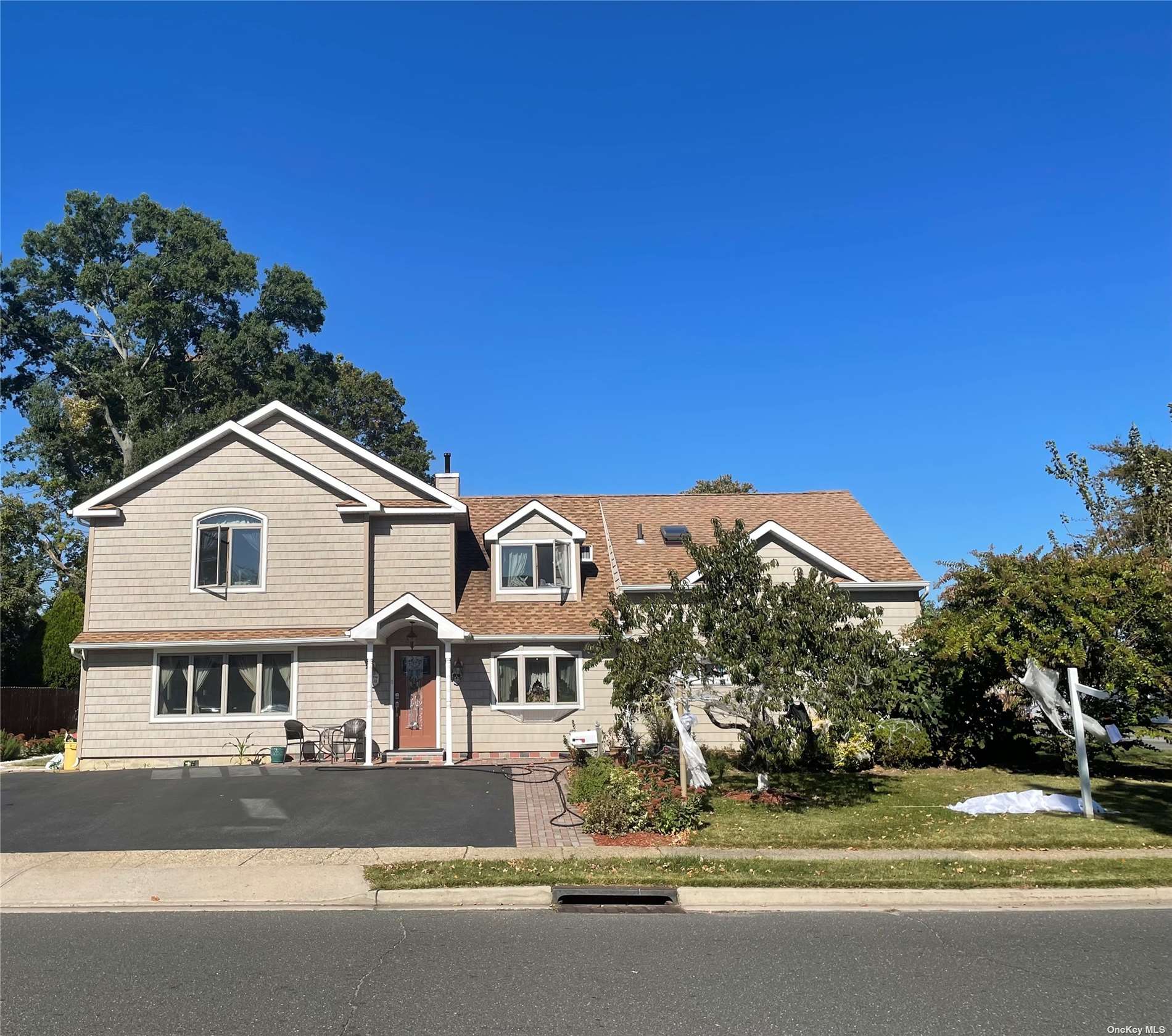 67 Spindle Road Hicksville, NY 11801 - Photo 1 of 1 a front view of a house with a yard