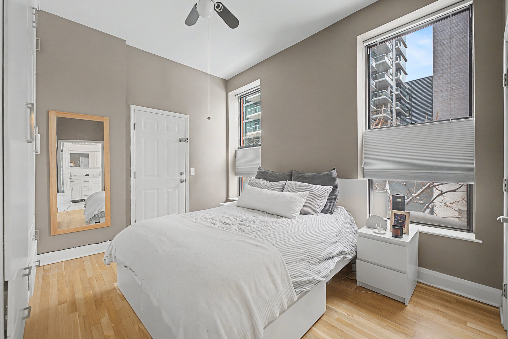 832 West Adams Street, Unit 2 Chicago, IL 60607 - Photo 11 of 23 a bedroom with a bed and a painting on the wall