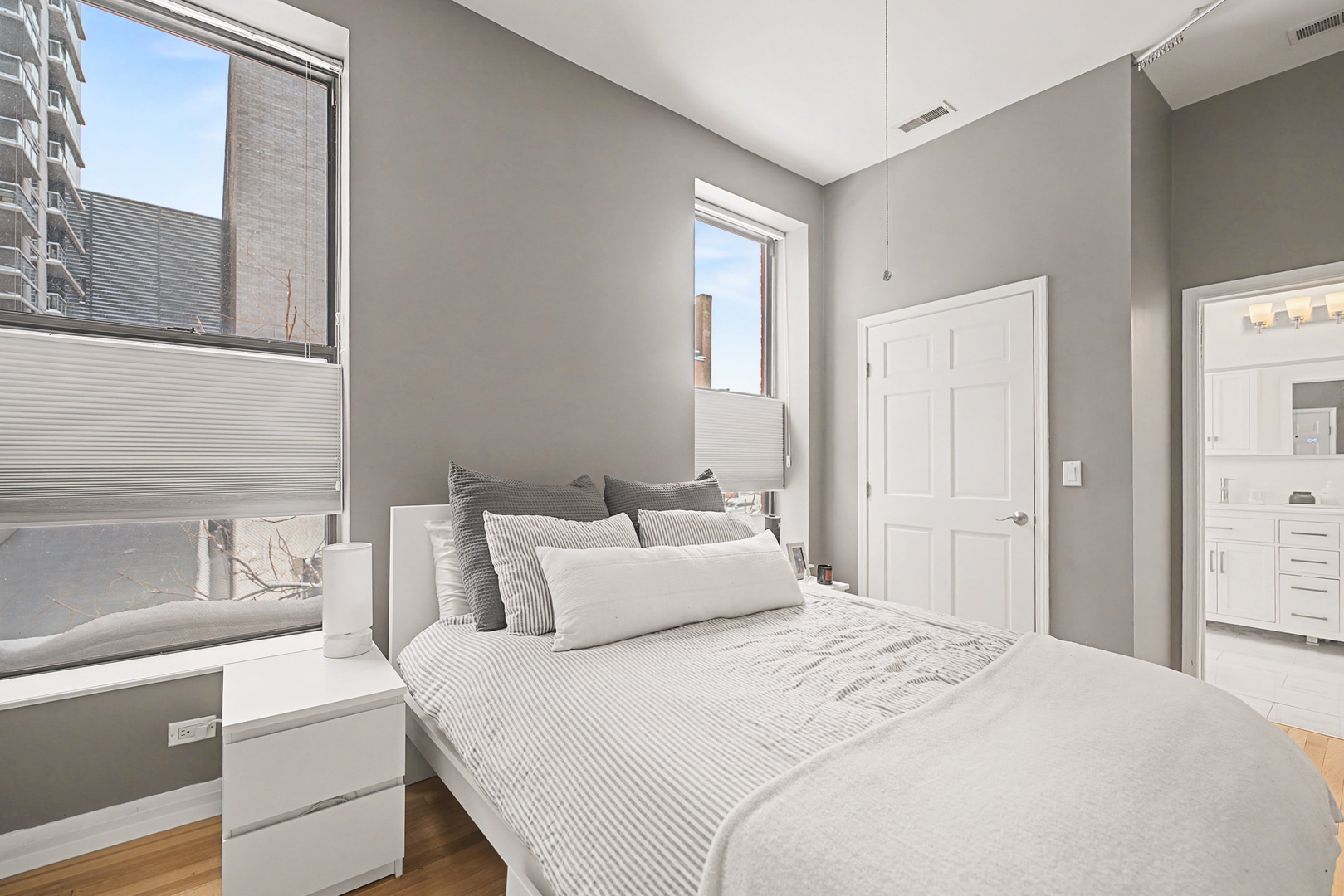 832 West Adams Street, Unit 2 Chicago, IL 60607 - Photo 12 of 23 a bedroom with a bed and a cabinets
