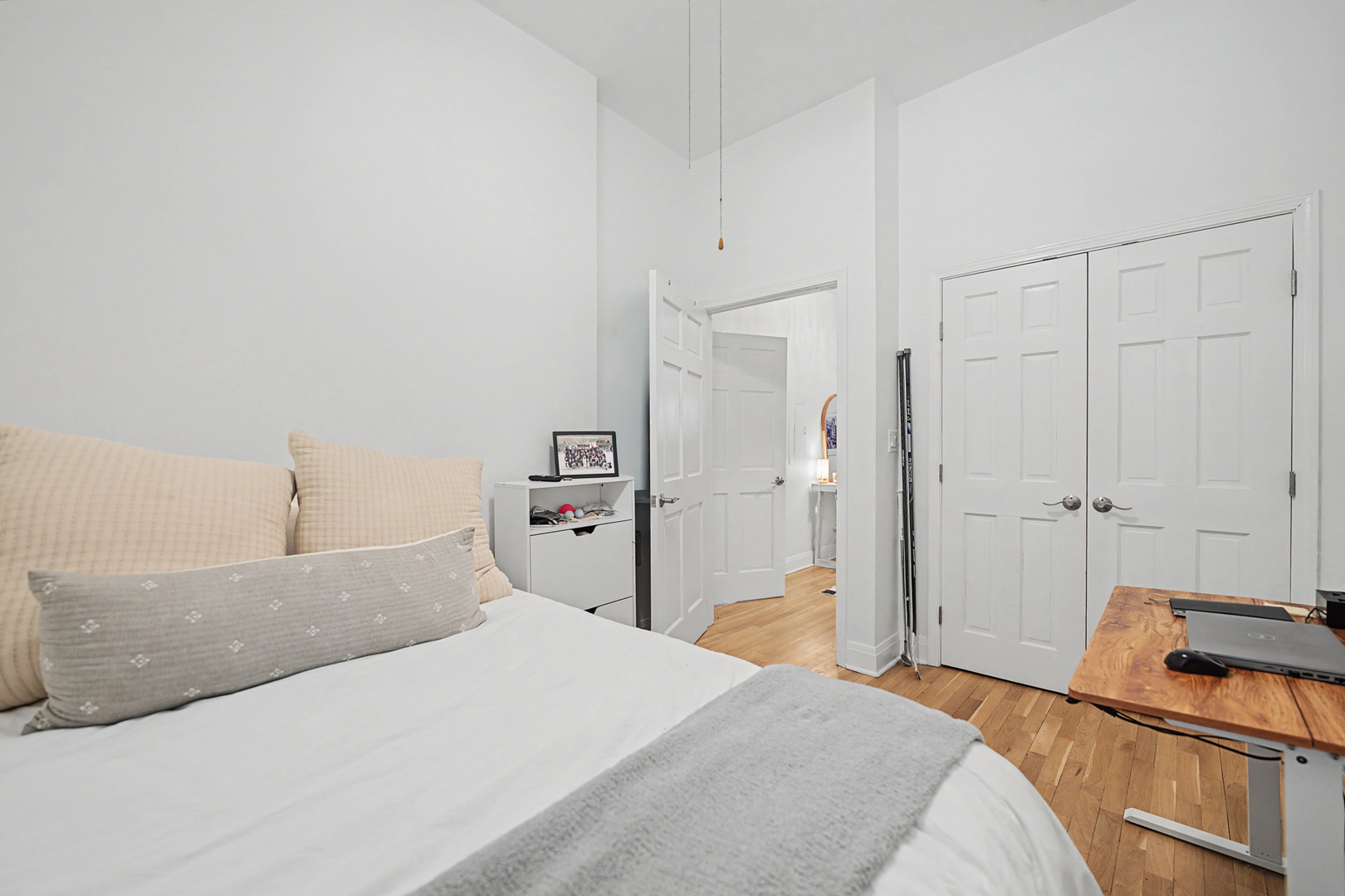 832 West Adams Street, Unit 2 Chicago, IL 60607 - Photo 16 of 23 a bedroom with a bed and a chandelier