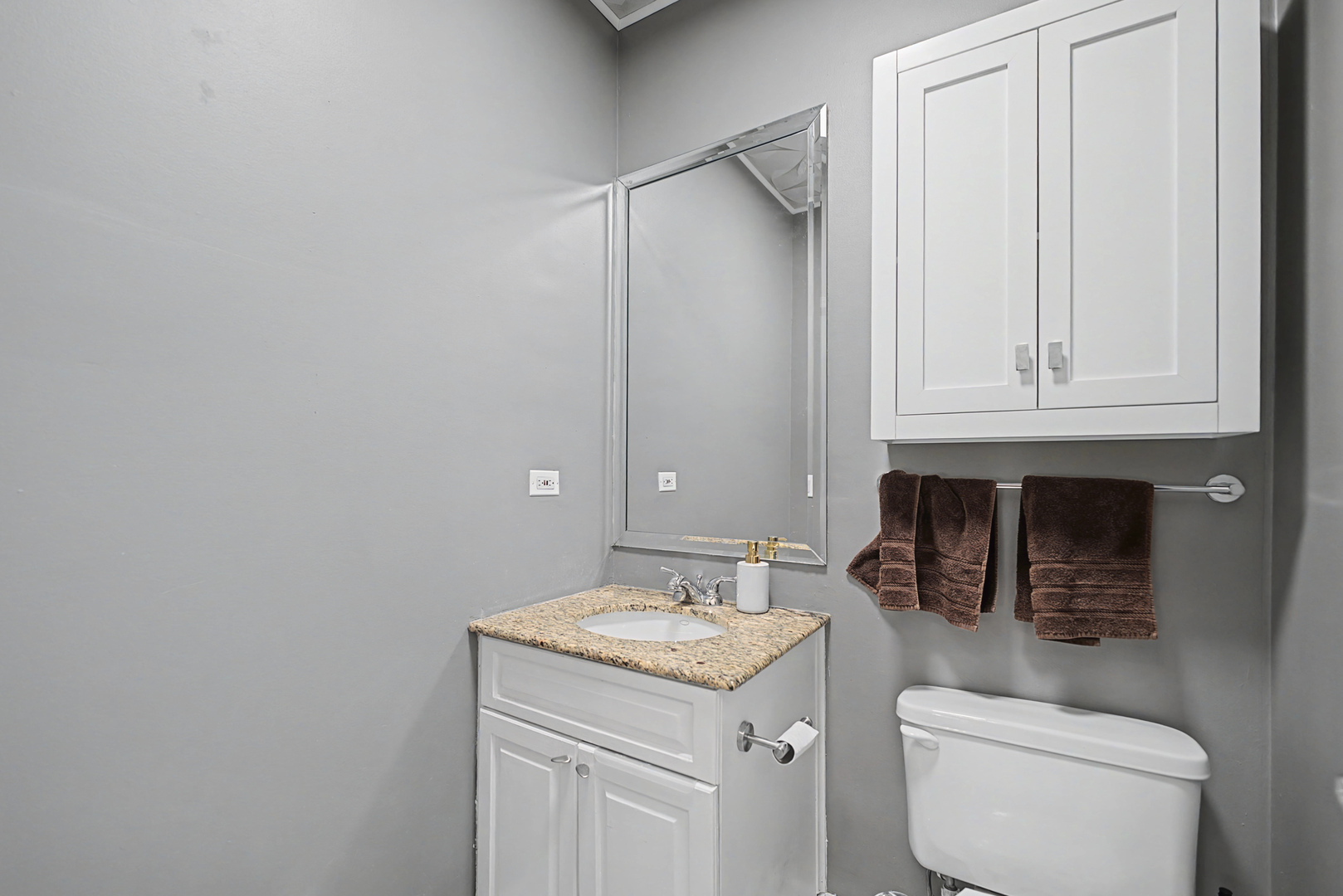 832 West Adams Street, Unit 2 Chicago, IL 60607 - Photo 17 of 23 a bathroom with a granite countertop sink a toilet and a mirror