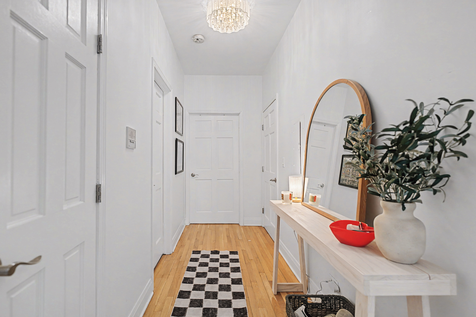 832 West Adams Street, Unit 2 Chicago, IL 60607 - Photo 10 of 23 a bedroom with a bed and a chandelier