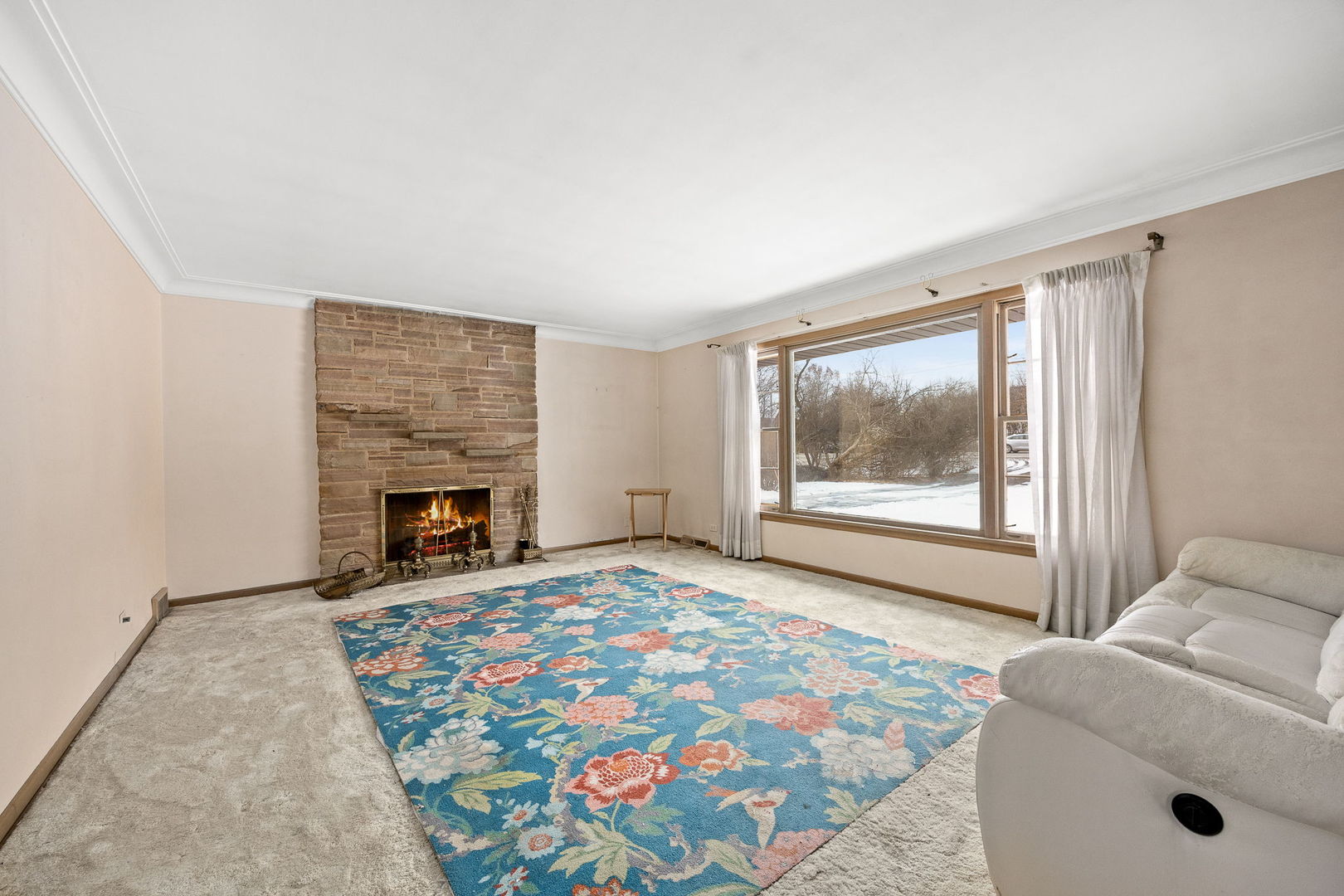 1927 Warrenville Road Lisle, IL 60532 - Photo 16 of 41 a living room with furniture and a fireplace