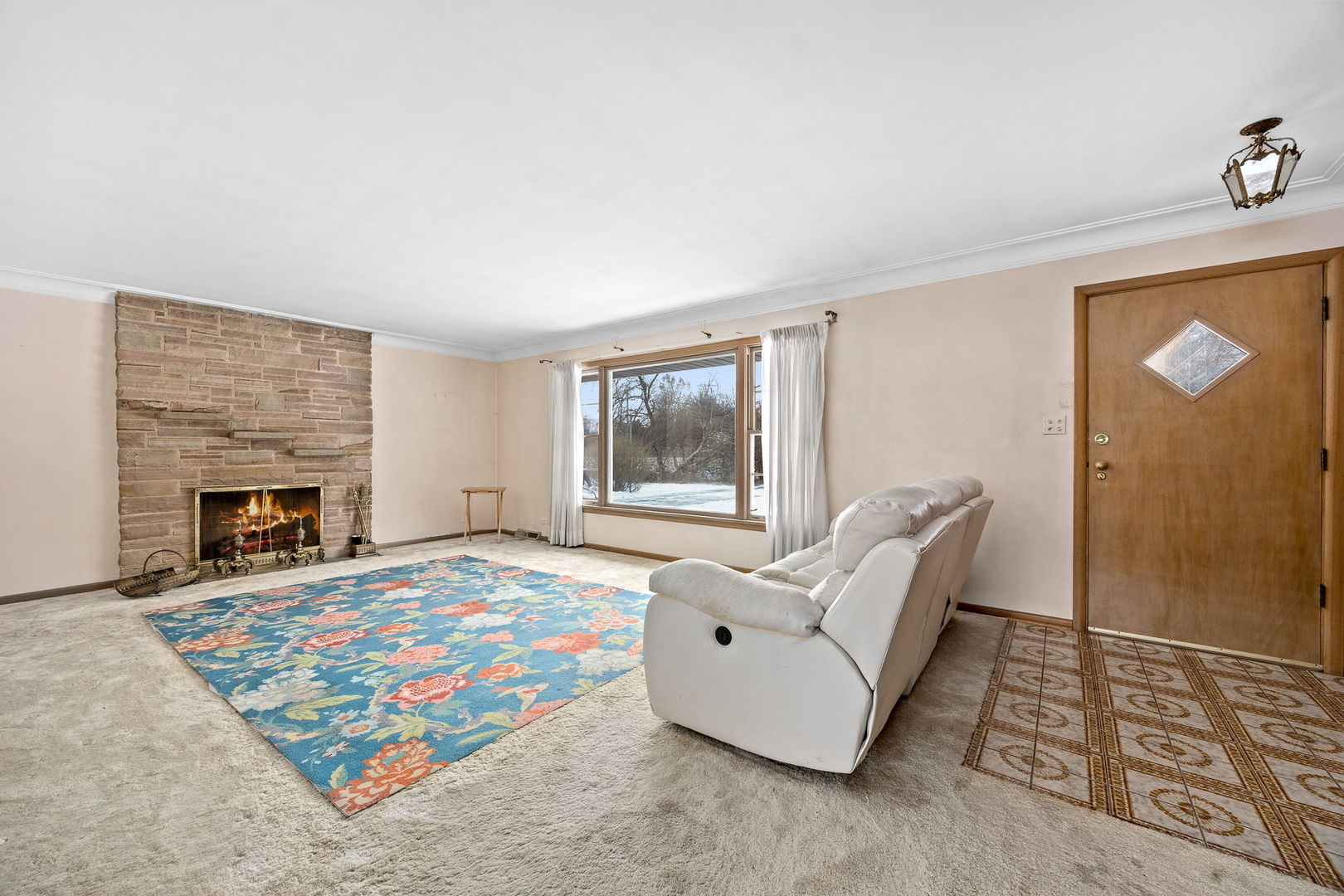 1927 Warrenville Road Lisle, IL 60532 - Photo 17 of 41 a living room with furniture and a fireplace