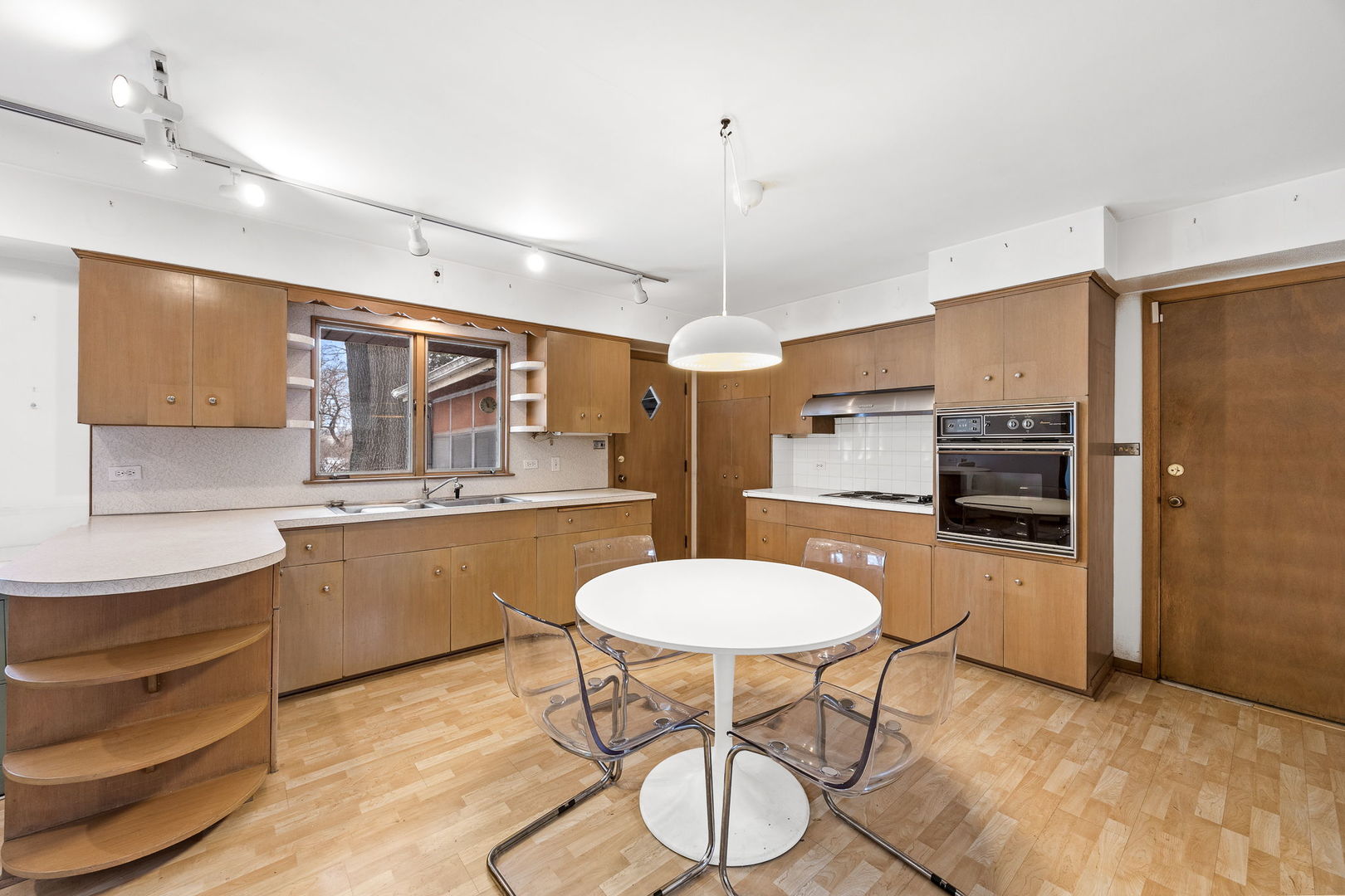 1927 Warrenville Road Lisle, IL 60532 - Photo 2 of 41 a kitchen with stainless steel appliances a stove a sink cabinets and wooden floor