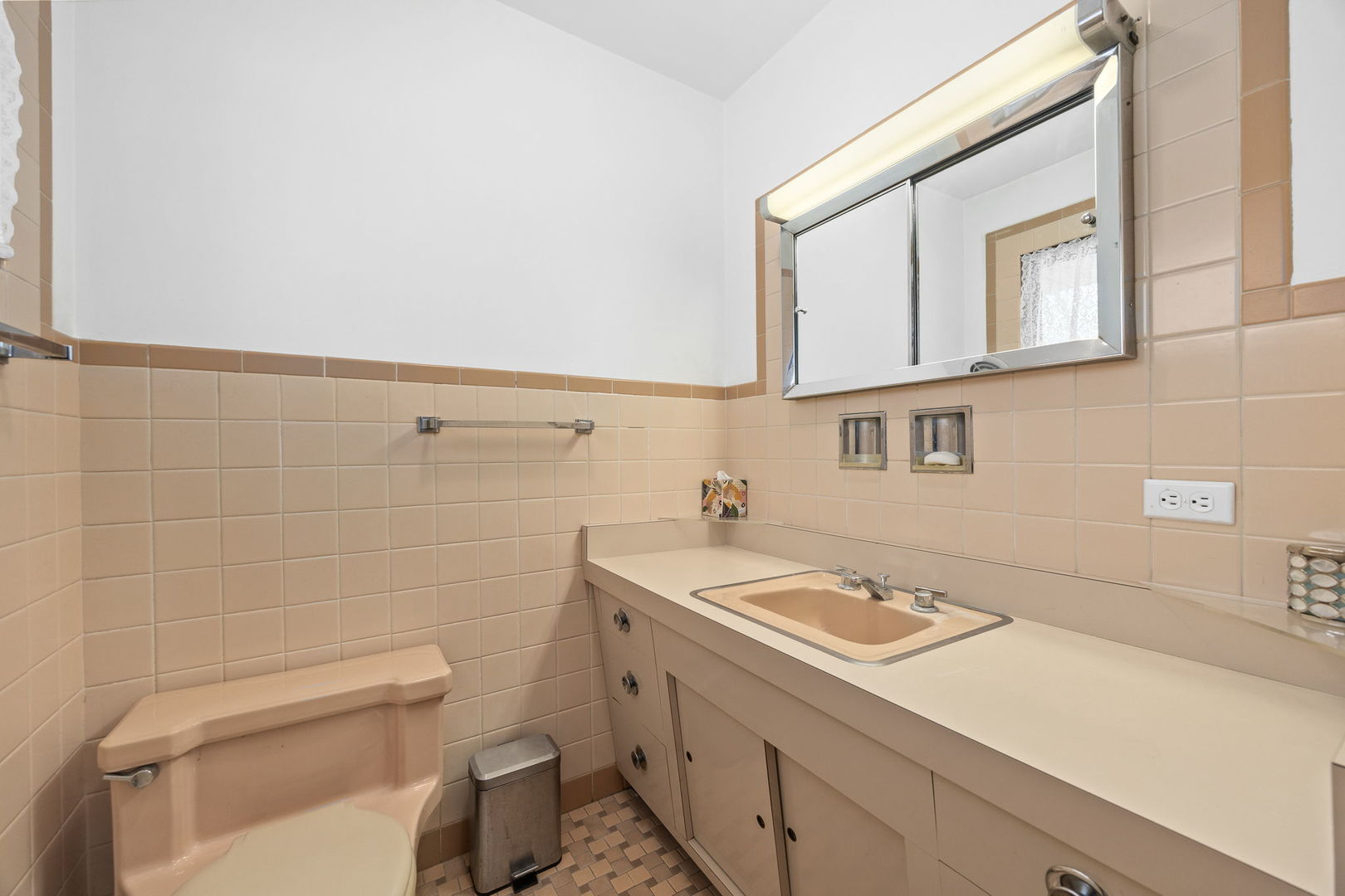 1927 Warrenville Road Lisle, IL 60532 - Photo 23 of 41 a bathroom with a sink a toilet and mirror
