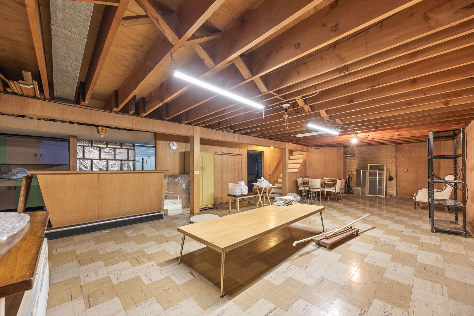 1927 Warrenville Road Lisle, IL 60532 - Photo 26 of 41 a living room with gym equipment and a table