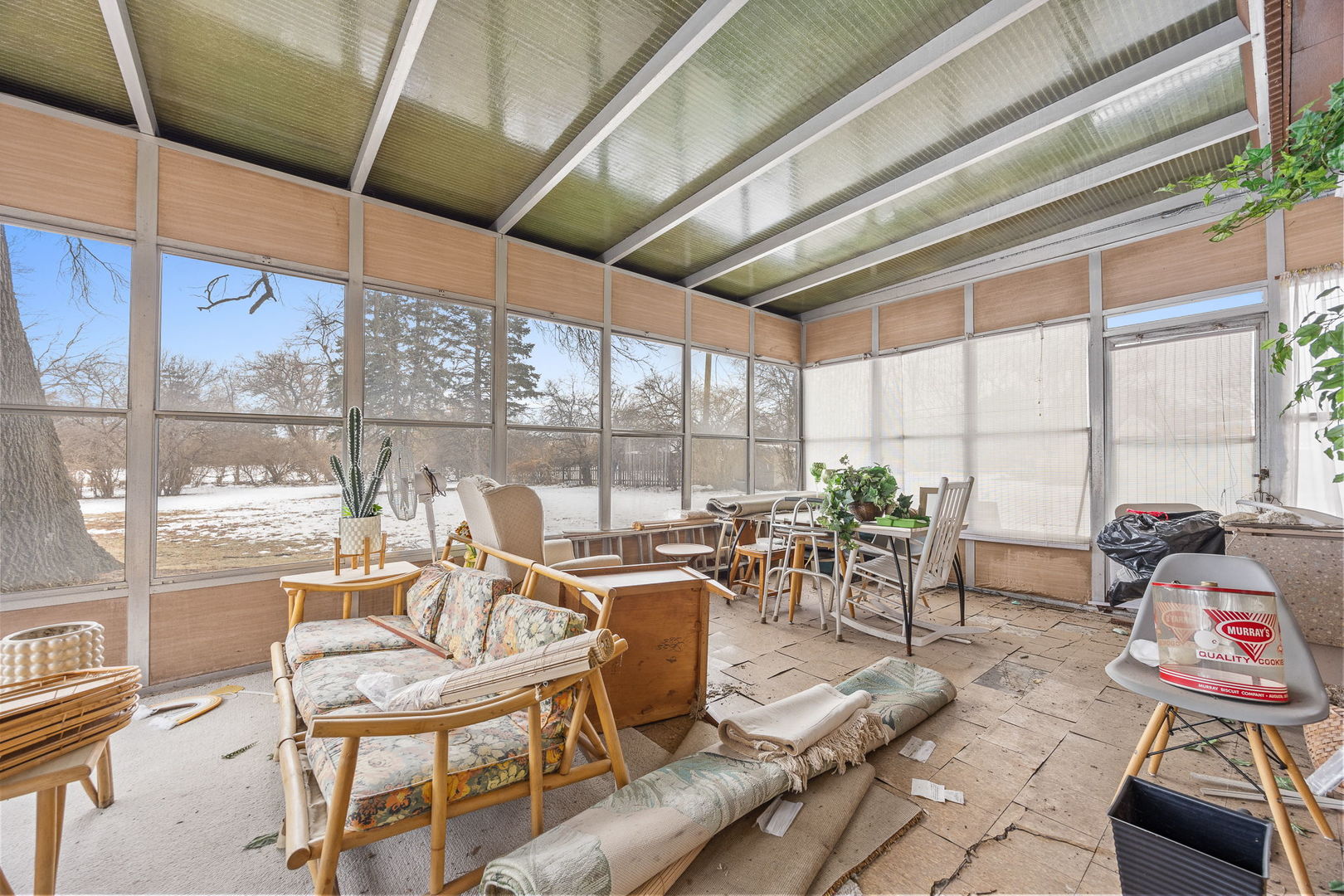 1927 Warrenville Road Lisle, IL 60532 - Photo 29 of 41 a living room with patio furniture and a floor to ceiling window