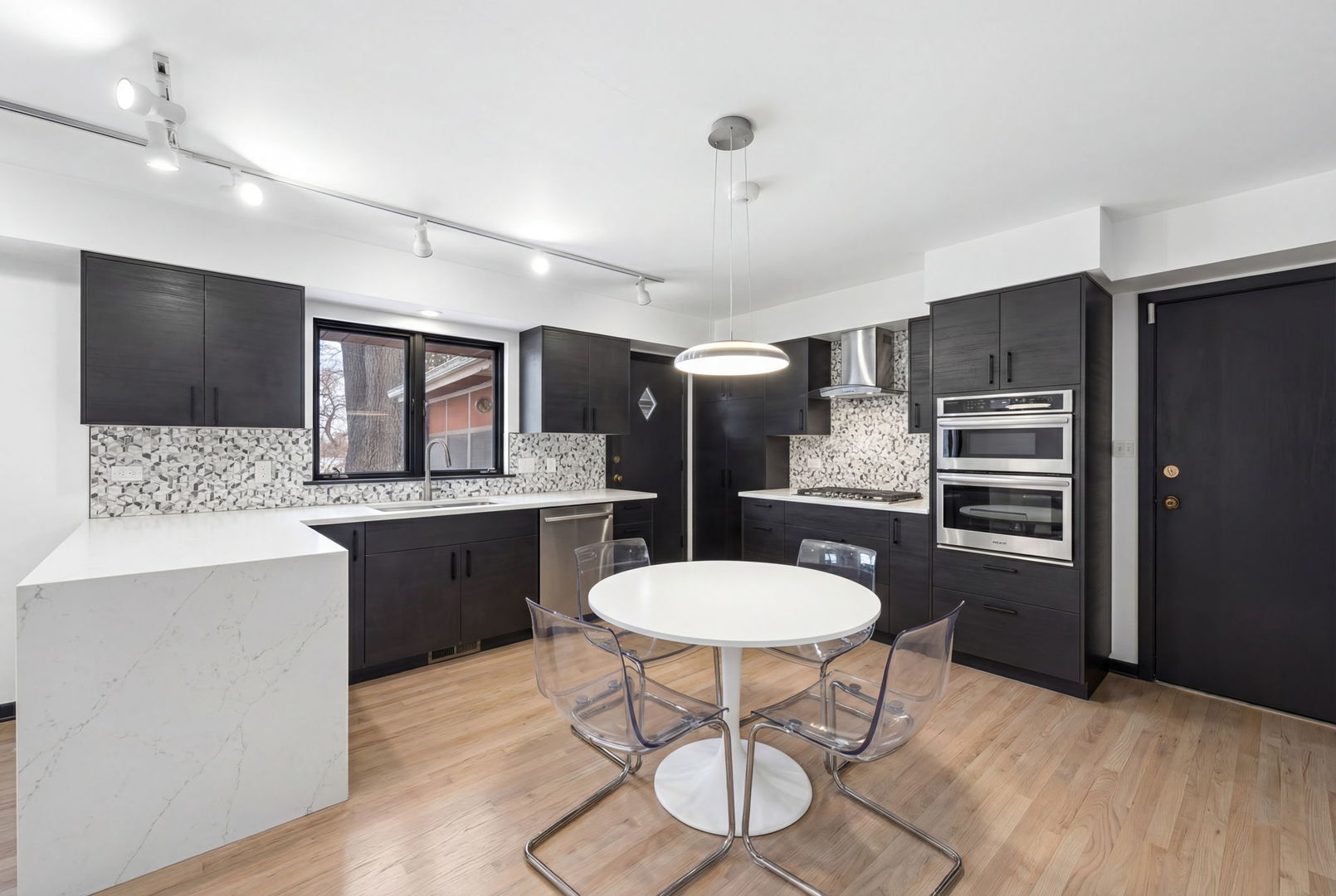 1927 Warrenville Road Lisle, IL 60532 - Photo 3 of 41 a kitchen with stainless steel appliances a sink stove and refrigerator