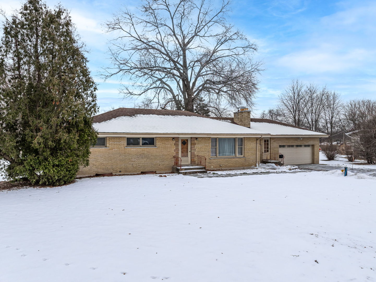 1927 Warrenville Road Lisle, IL 60532 - Photo 32 of 41 a front view of a house with yard covered by trees