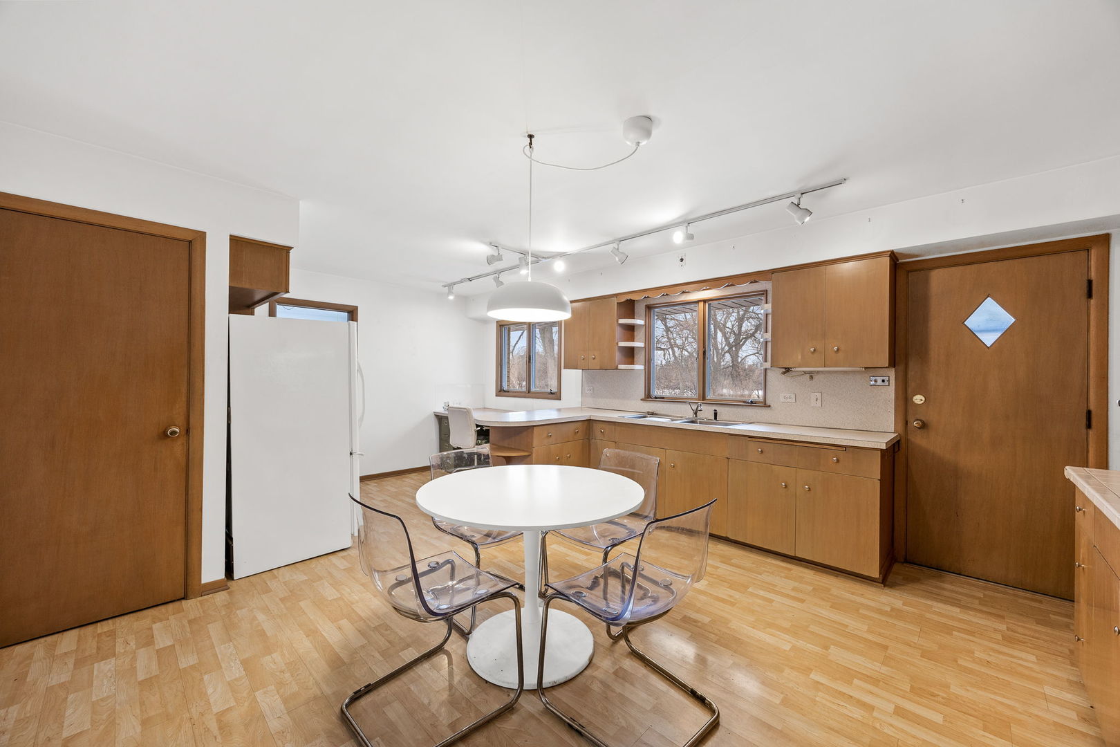 1927 Warrenville Road Lisle, IL 60532 - Photo 4 of 41 a kitchen with stainless steel appliances granite countertop a sink and a refrigerator
