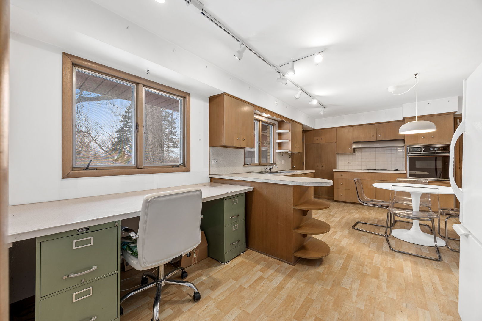 1927 Warrenville Road Lisle, IL 60532 - Photo 5 of 41 a view of a workspace with furniture and a window