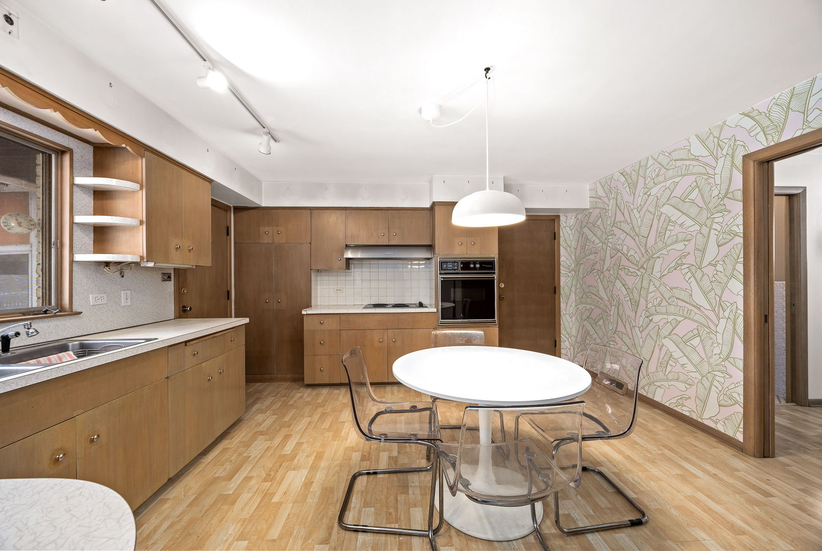 1927 Warrenville Road Lisle, IL 60532 - Photo 6 of 41 a kitchen with stainless steel appliances a dining table chairs and sink