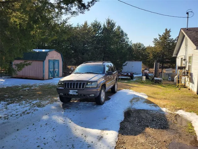 a swimming pool with outdoor seating and yard