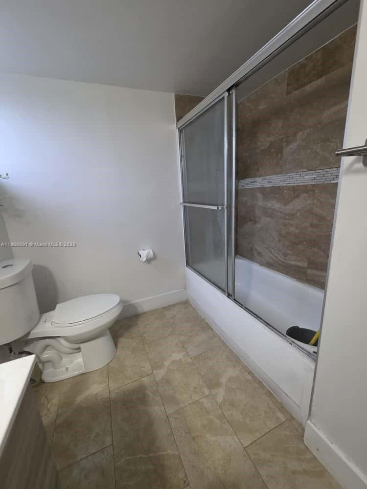 1710 Northeast 191st Street, Unit 3013 Miami, FL 33179 - Photo 12 of 23 a bathroom with a toilet and a shower