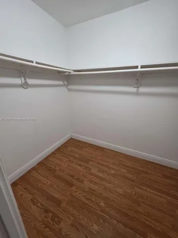 a view of a room with shelf on the wall