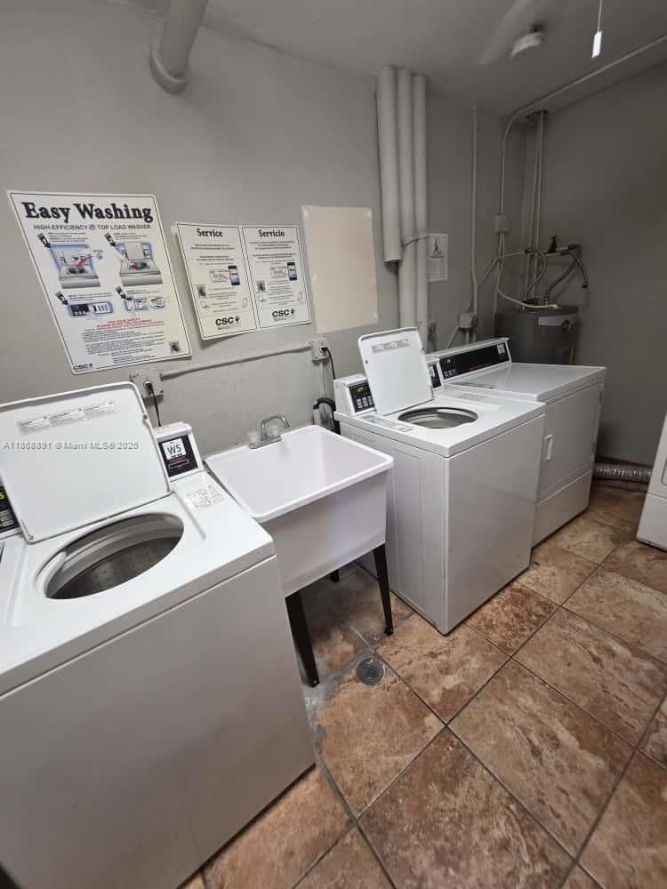 1710 Northeast 191st Street, Unit 3013 Miami, FL 33179 - Photo 20 of 23 a utility room with dryer and washer
